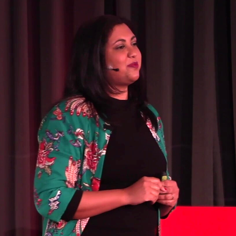 Cheryl Benadie speaking on stage